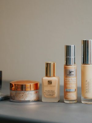 A stylish display of various beauty products including makeup and perfume bottles.